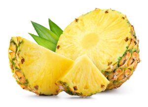 Cut pineapple with pieces on white background