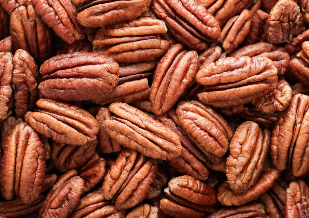 Raw peeled brown pecan nuts