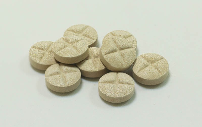 Several round deworming pills for animals