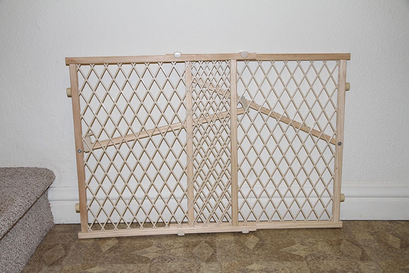 Baby Gate / Dog Gate on The Ground Next to the Stairs