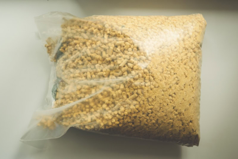 Bag of cat litter inside a car trunk