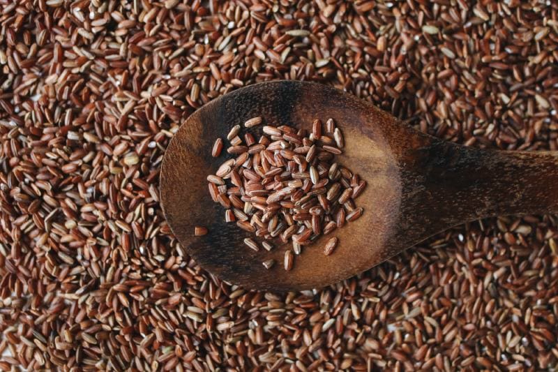 Brown Rice On Wooden Spoon