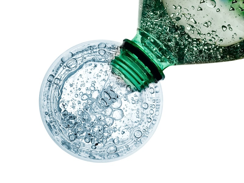 Carbonated water being poured into glass