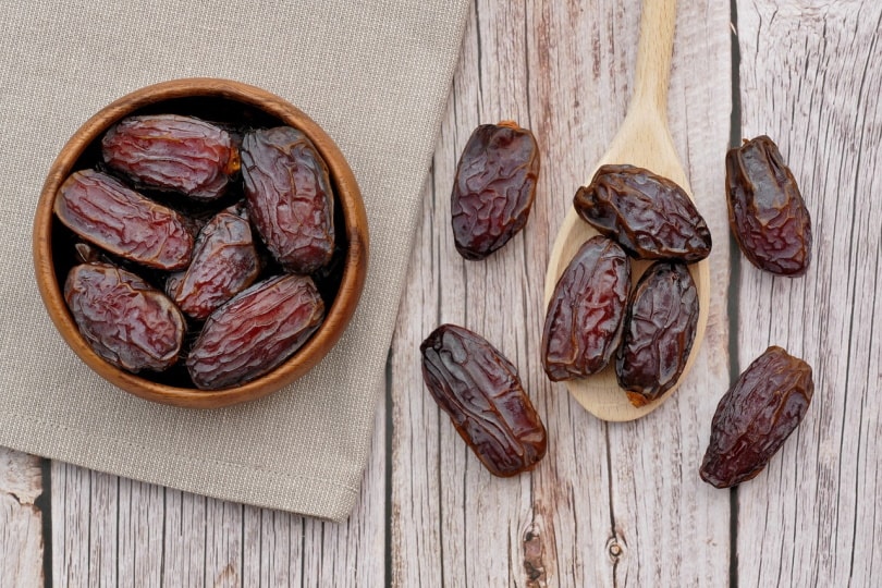 Dates in a bowl on table