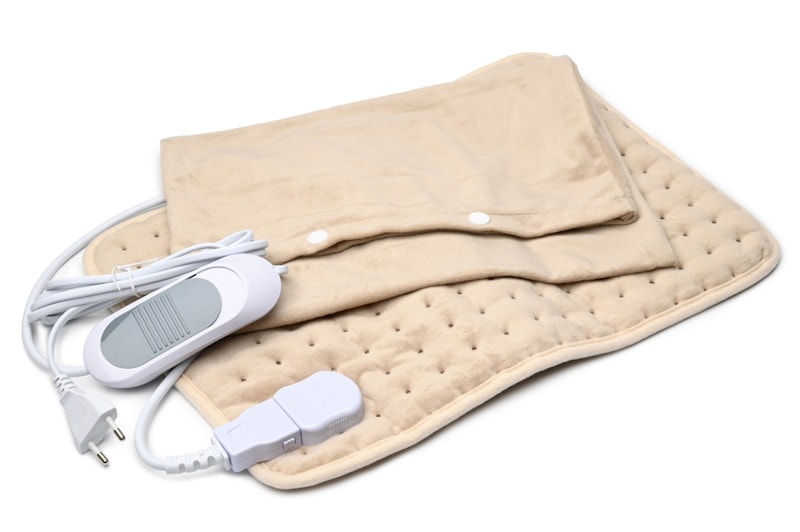 Electric heating pad on white background