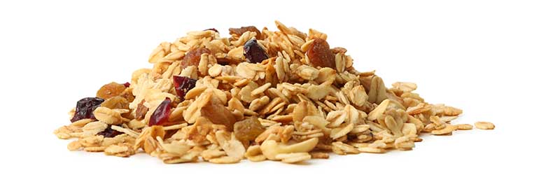 Granola with nuts and raisins isolated on white background
