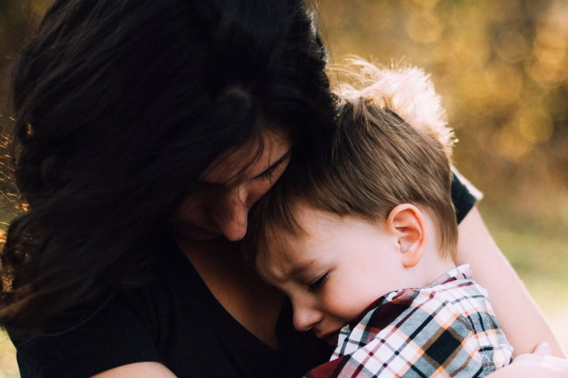 Mother comforting a crying child