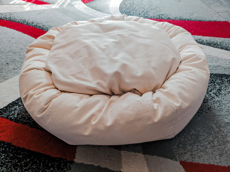 Nest Bedding Dog Bed - product on carpet