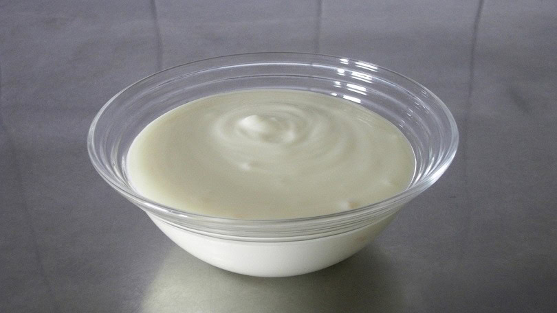Plain yogurt in small bowl