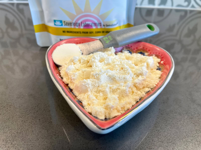 Super Pet Nutrition Colostrum-LD Powder - powder in heart-shaped bowl