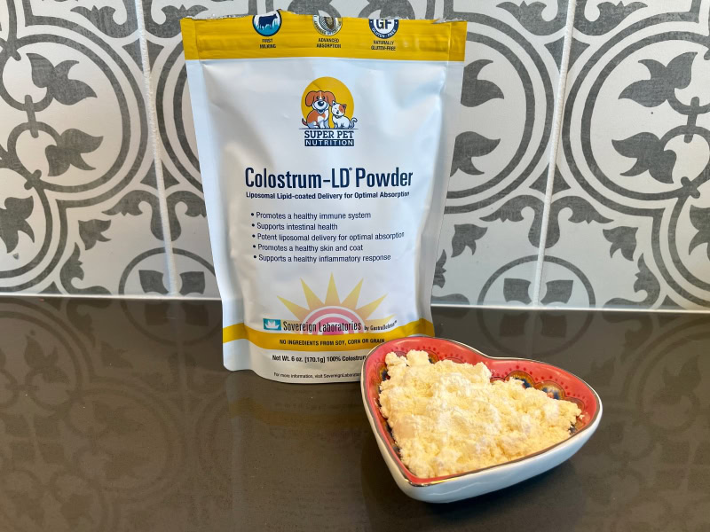 Super Pet Nutrition Colostrum-LD Powder - product packaging and powder in bowl