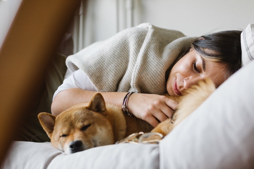 Woman and dog sleeping