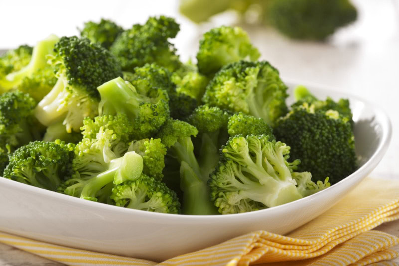 a bowl of steamed broccoli