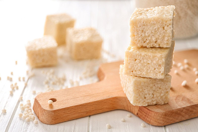 a stack of rice krispies on a chopping board