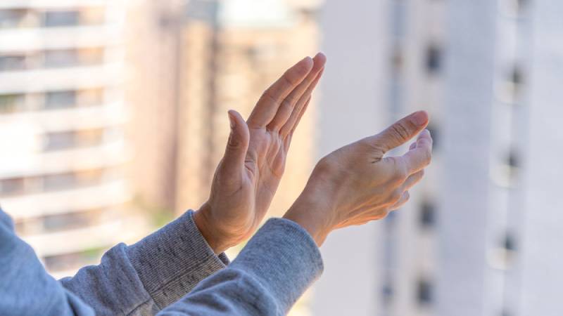 a woman clapping her hands