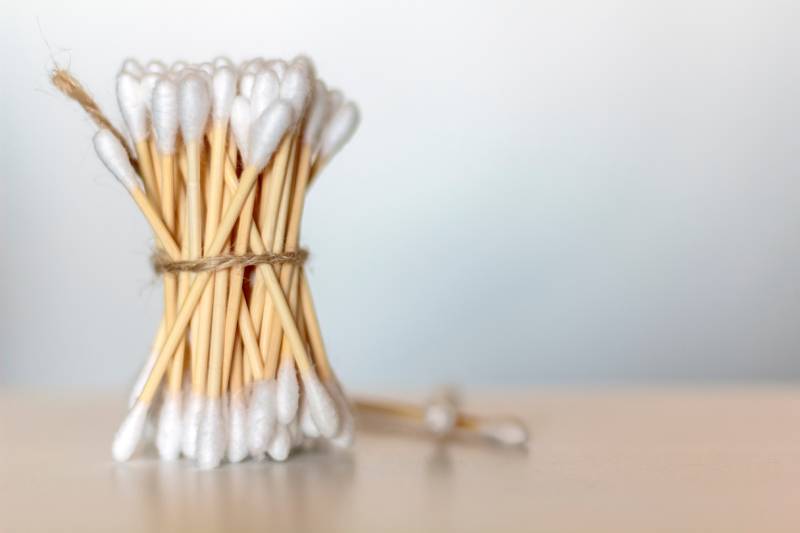 bamboo cotton swabs on wooden table