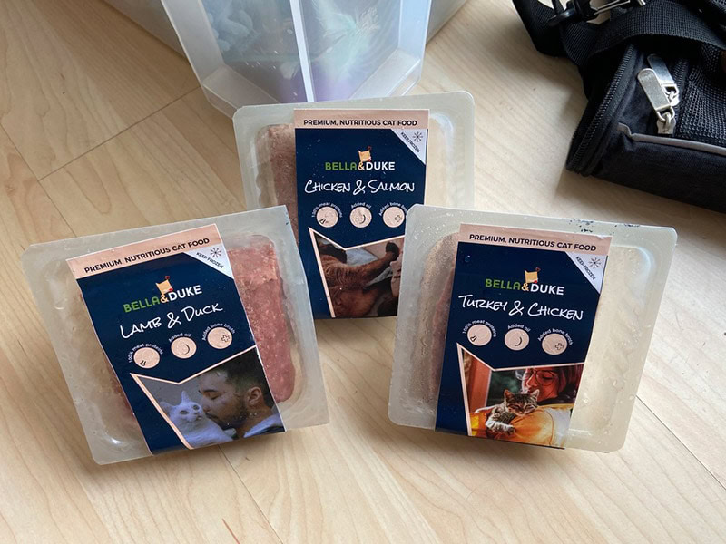 bella and duke cat food tubs