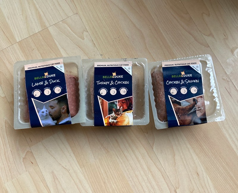 bella and duke cat food tubs