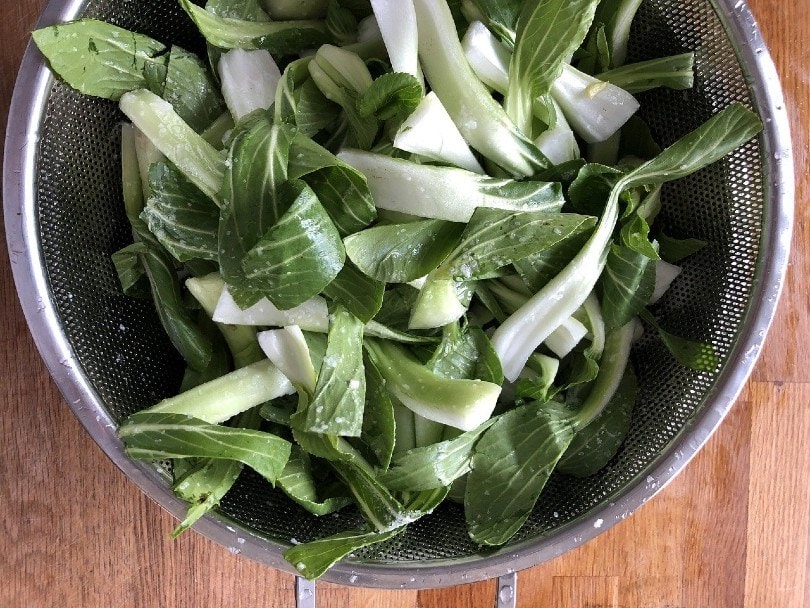 bok choy in a strainer