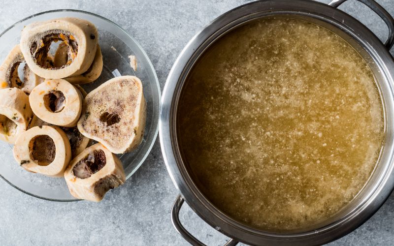 bone broth bouillon in stainless steel pot