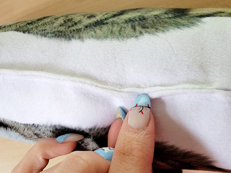 closeup of seam puckering of the petsies pillow