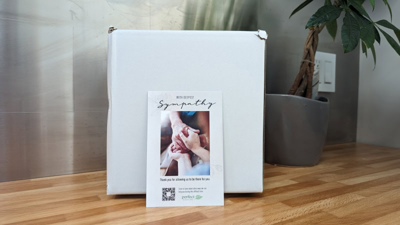 cremation urn in the box and symphaty note from perfect memorials