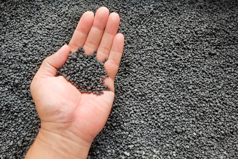 hand holding aquarium gravel