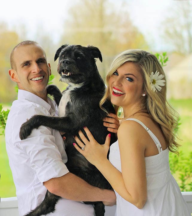 happy couple with dog