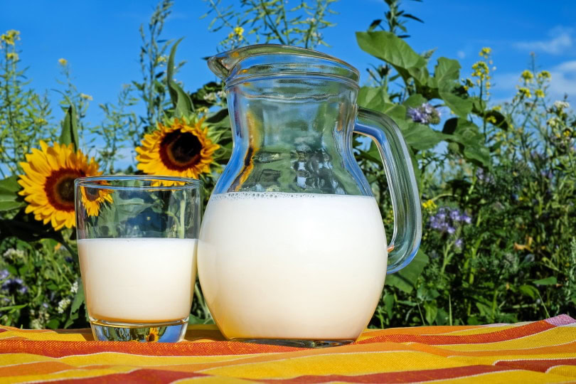 milk in glass and pitcher