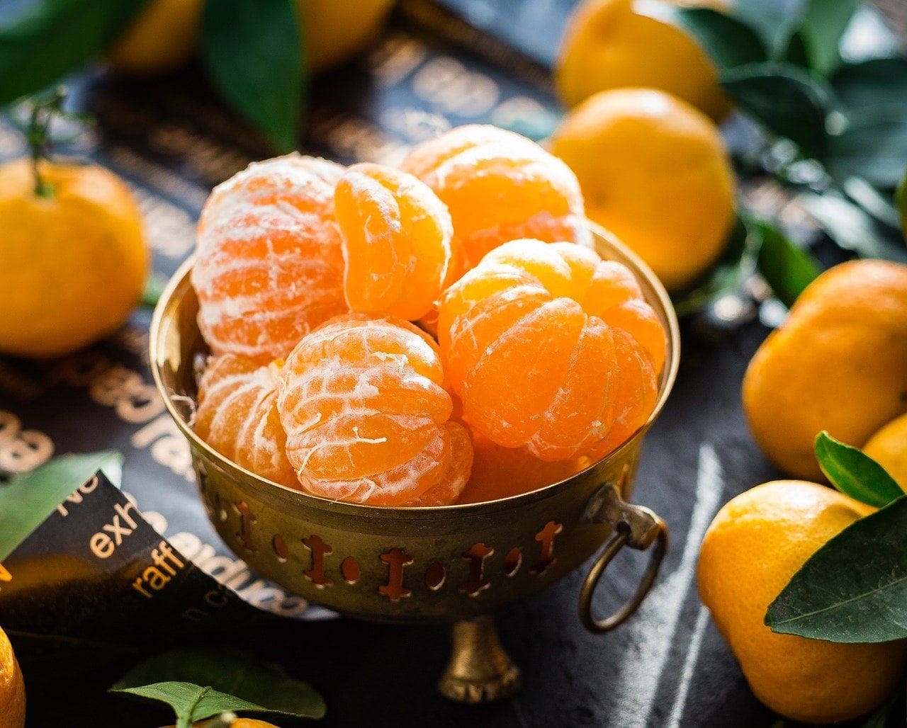 peeled mandarin oranges in a cup