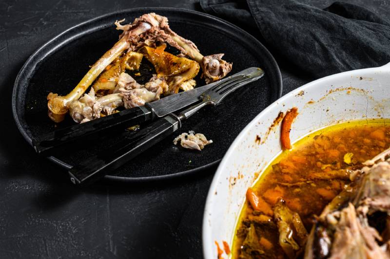 plate of chicken bones on a dinner plate