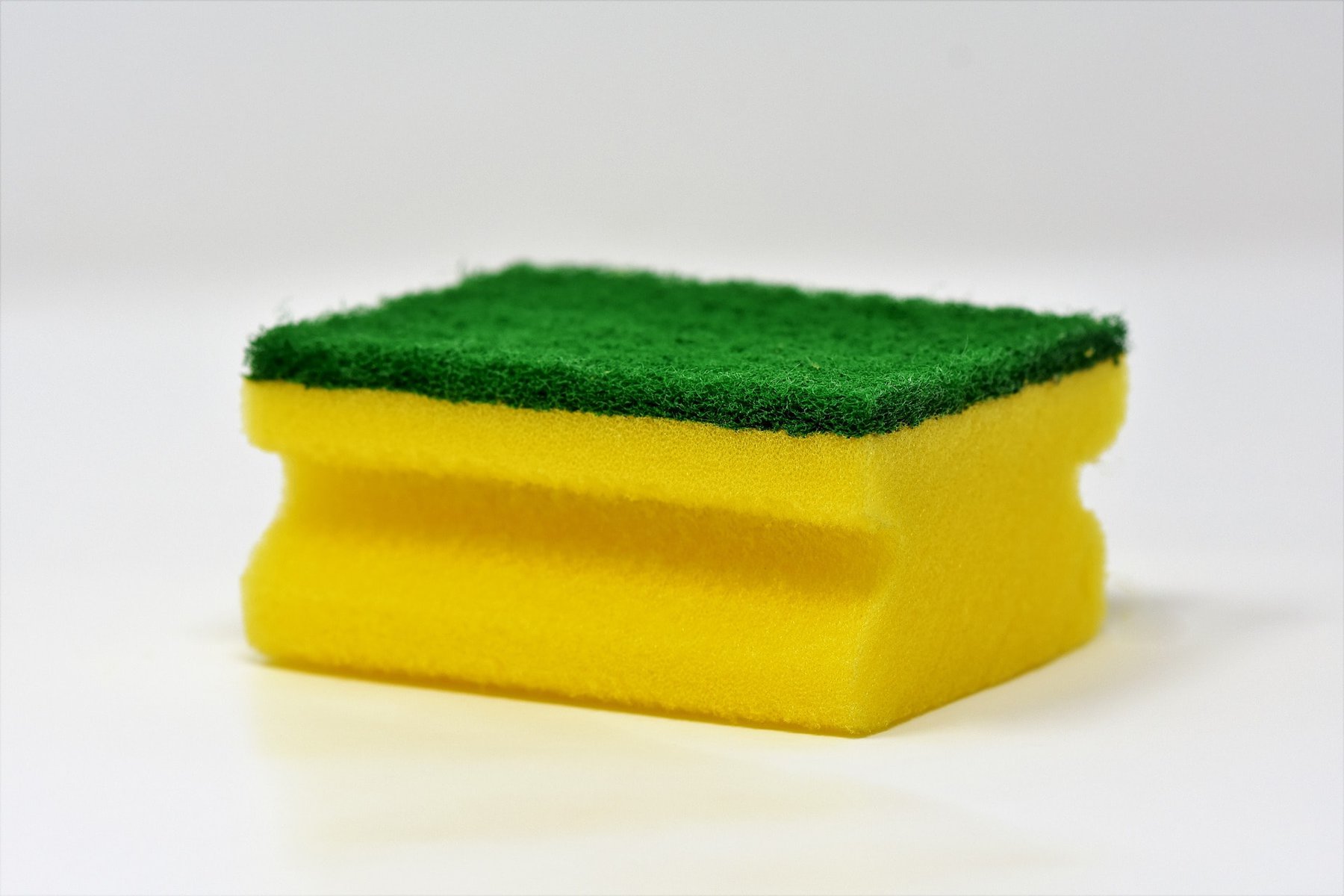 Dry sponge on side used to clean