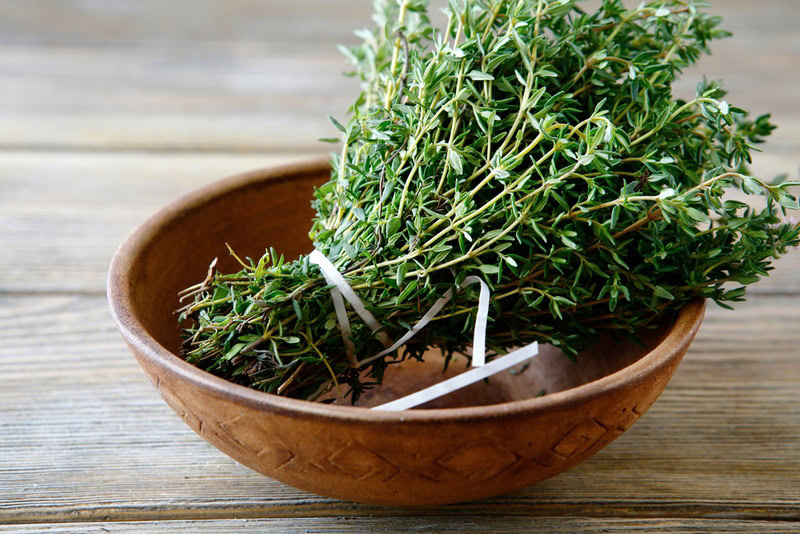thyme in brown bowl