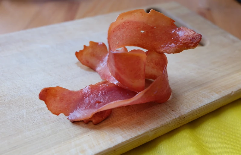 turkey bacon on wood cutting board