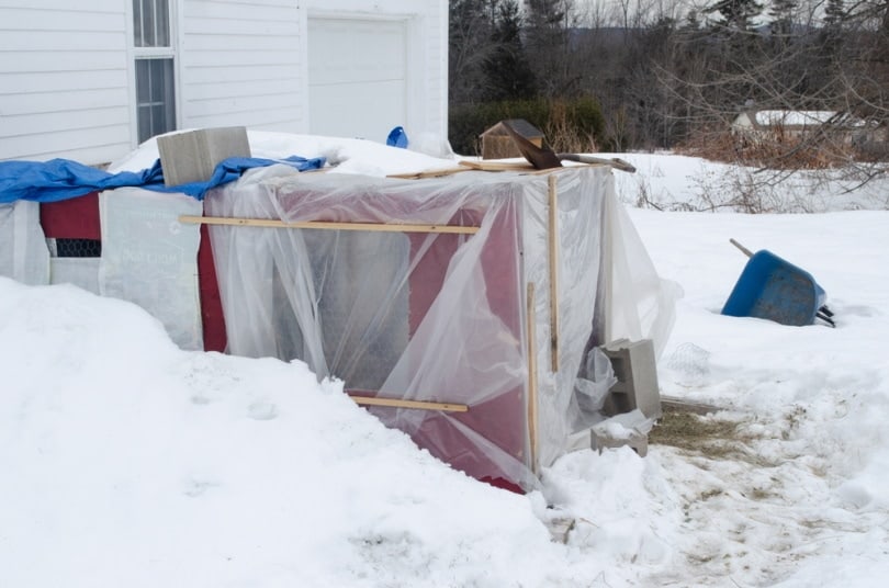 Chicken coop covered in plastic for added insulation